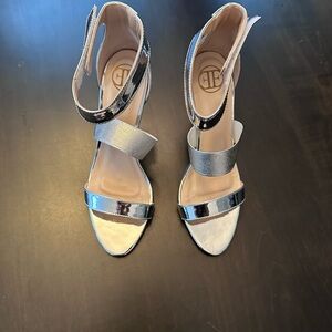 Silver high heels. Size 8.5. Brand new.
